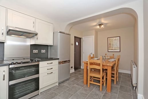 Kitchen with dining area. dishwasher and washer dryer