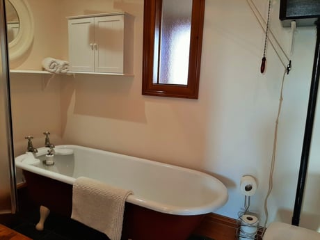 Bathroom with separate shower cubicle and bath.