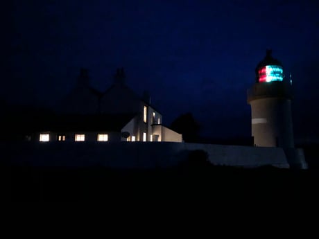 Lighthouse and Lodge by night